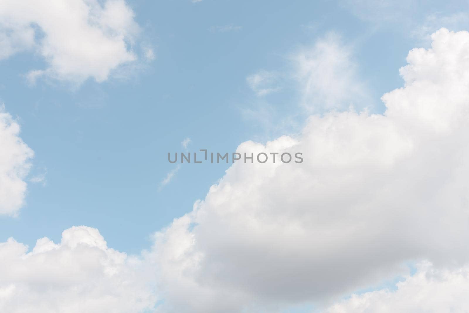 Natural sky background with clouds in light tonality. Abstract nature image for background use.