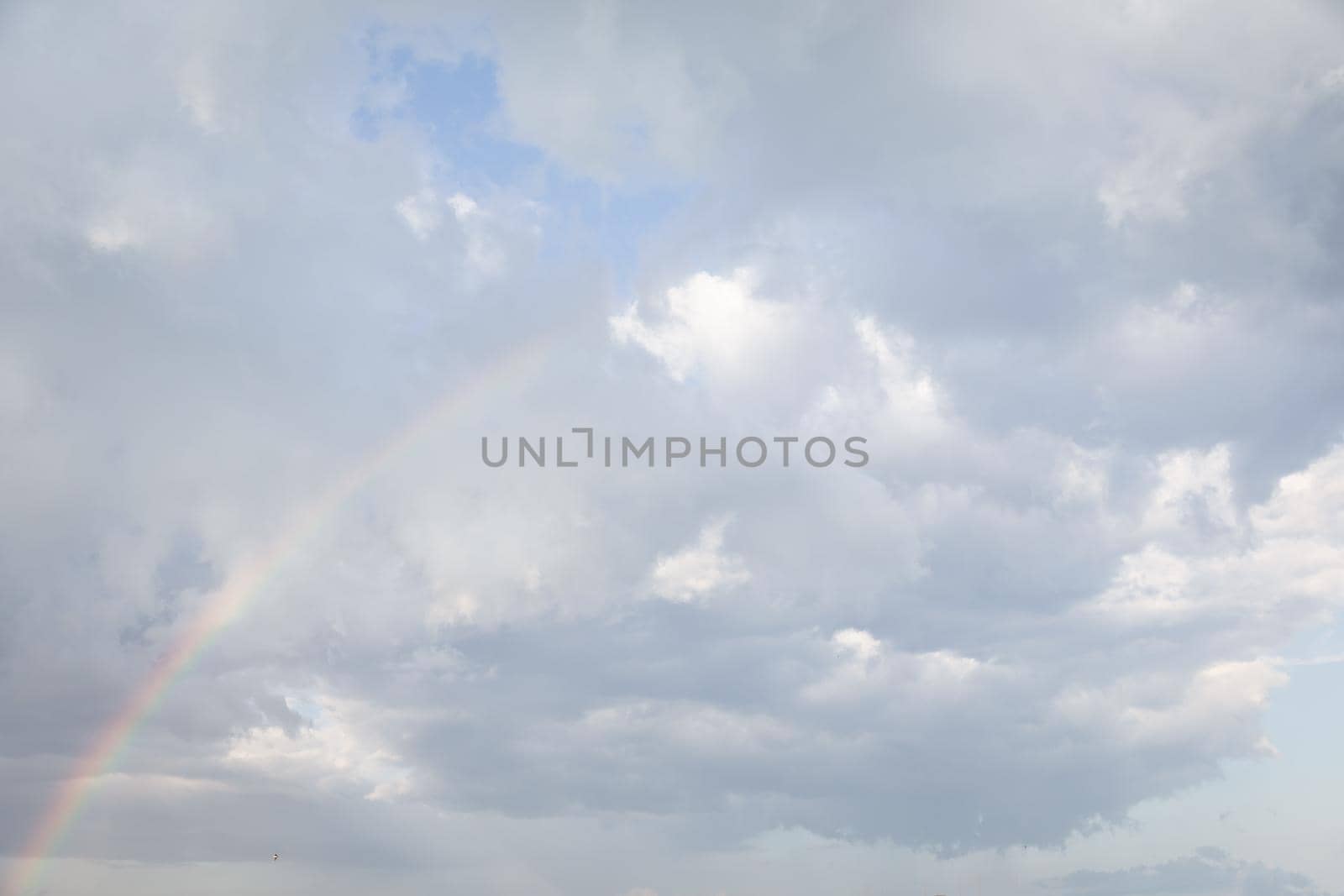 Natural sky background with clouds in light tonality. Abstract nature image for background use.