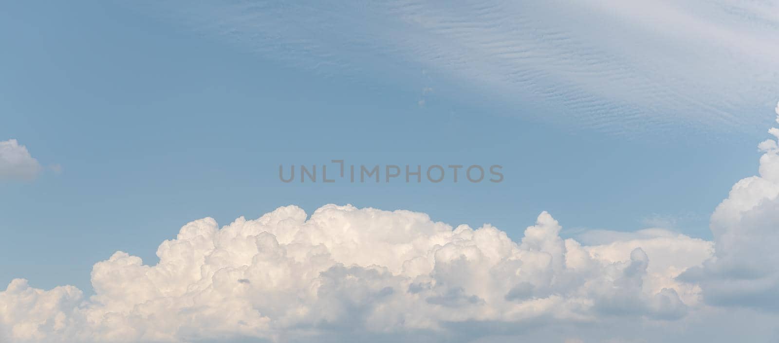 Abstract natural background. Beautiful white clouds against blue sky