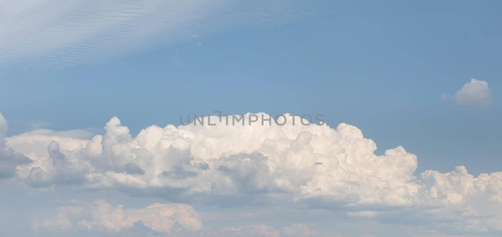 Abstract natural background. Beautiful white clouds against blue sky