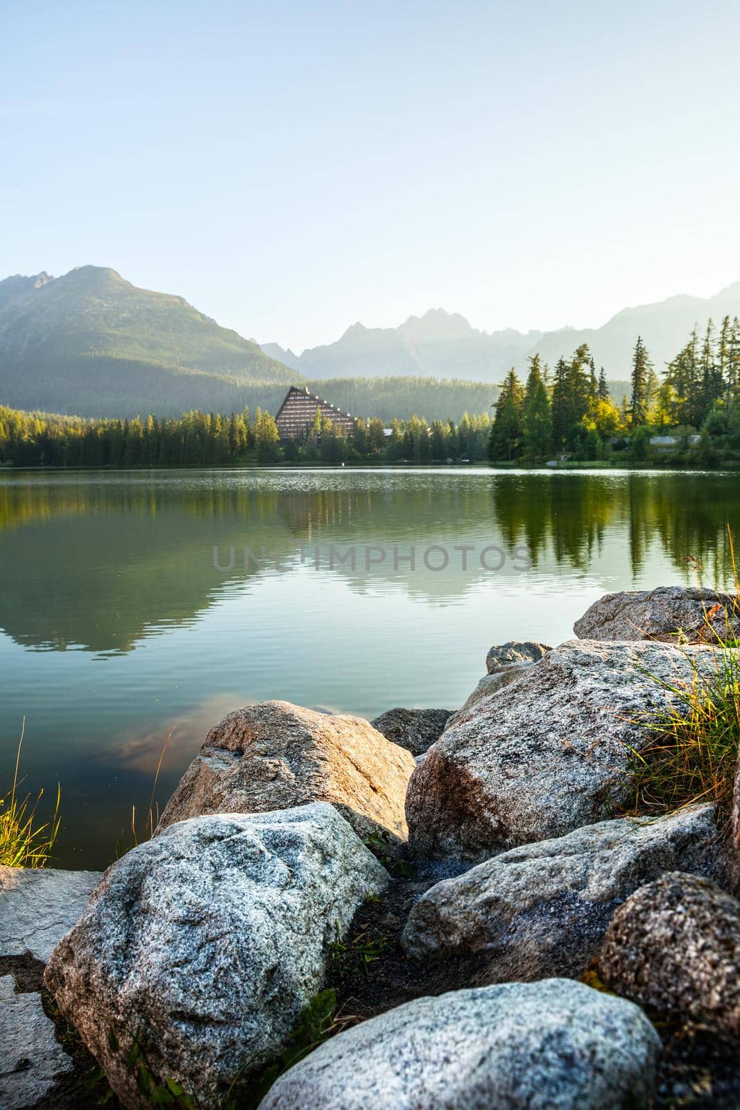Mountain lake in High Tatra. Strbske pleso, Slovakia, Europe. Focus on stones