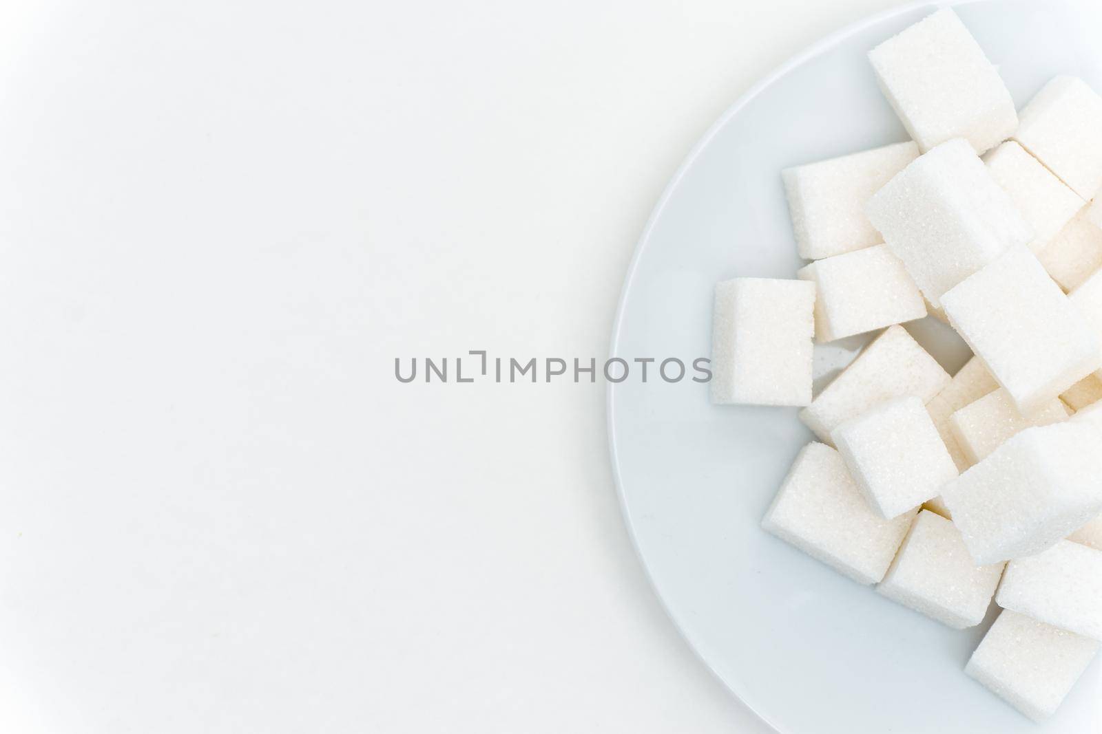 refined sugar on a plate calories sweets. High quality photo