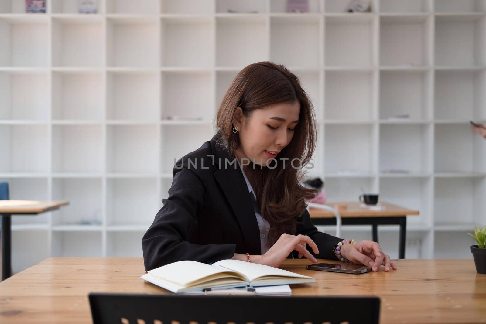 business, technology concept - Portrait of woman hands texting message on smartphone at office
