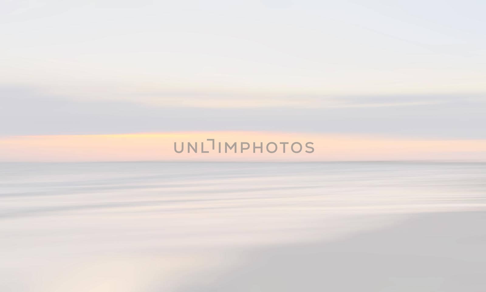 Abstract blurred sea landscape and cloudy sky background in light tonality with copy space
