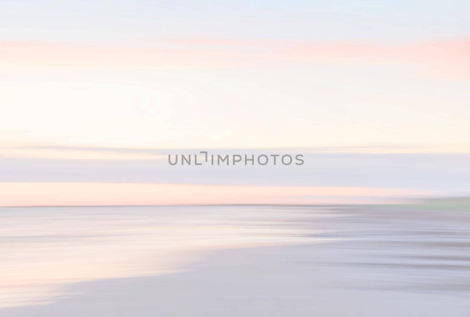 Abstract blurred sea landscape and cloudy sky background in light tonality with copy space