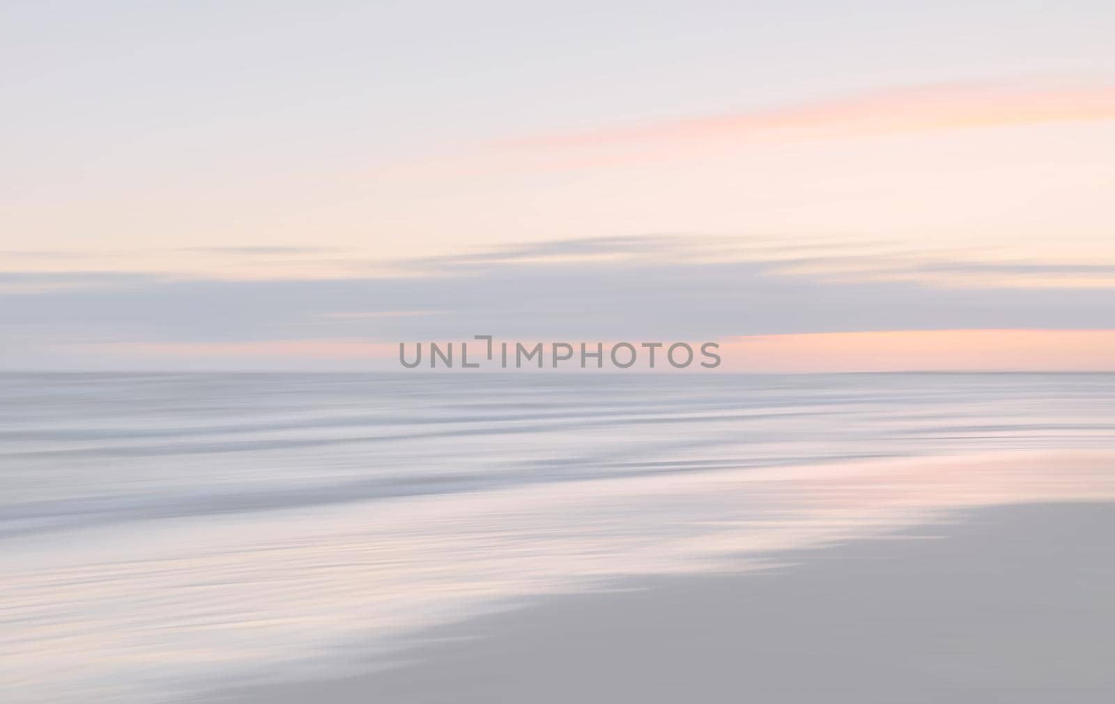 Abstract blurred sea landscape and cloudy sky background in light tonality with copy space