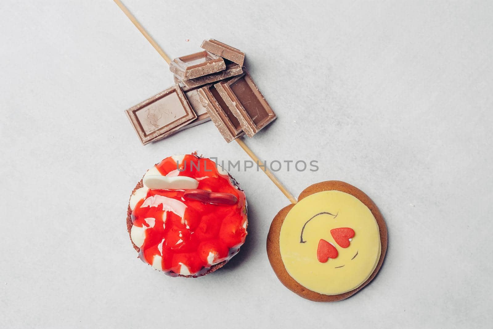 gingerbread in the form of a smiley on a stick marmalade sweets dessert. High quality photo