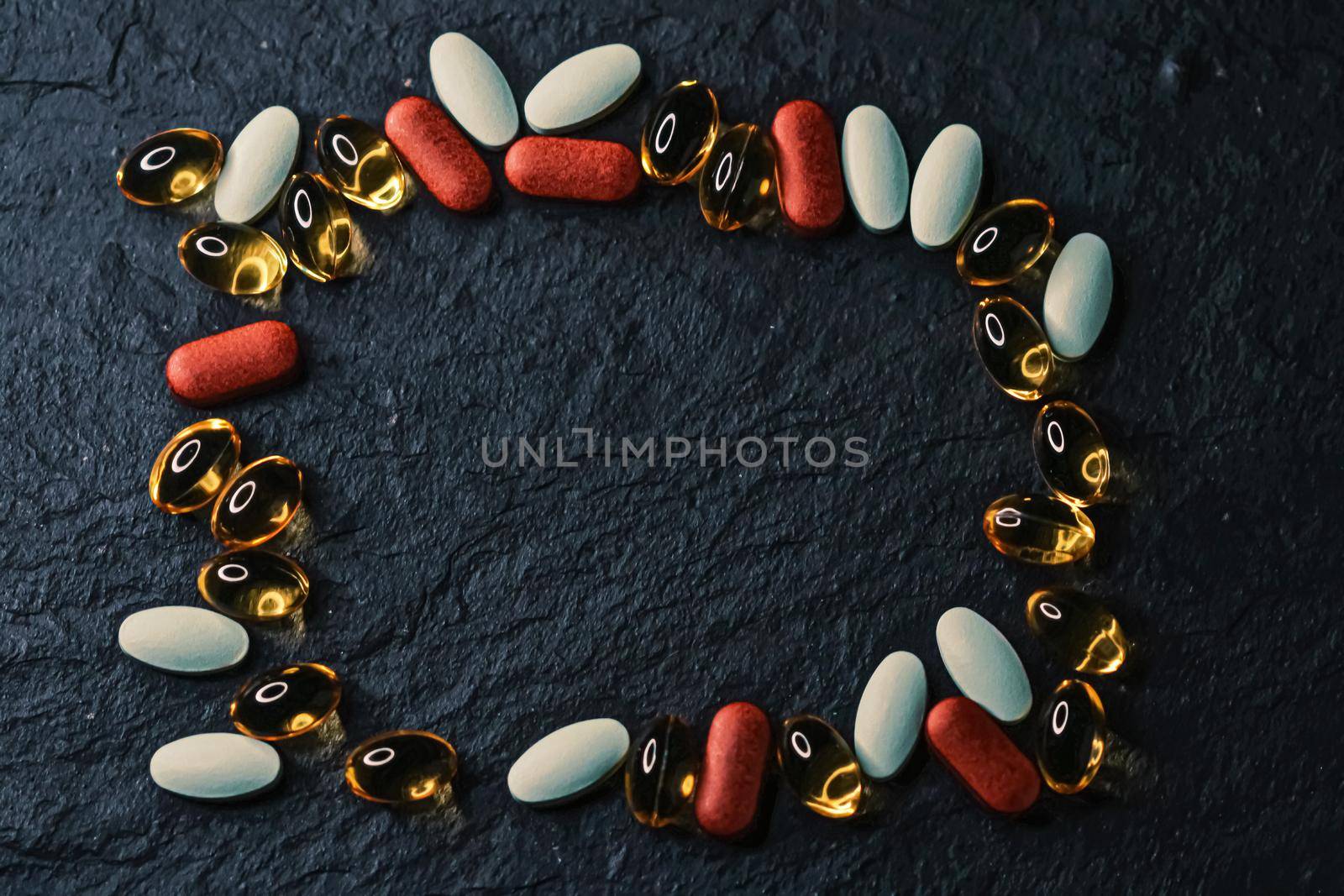 Frame made of medical pills as flatlay background, health and wellness closeup