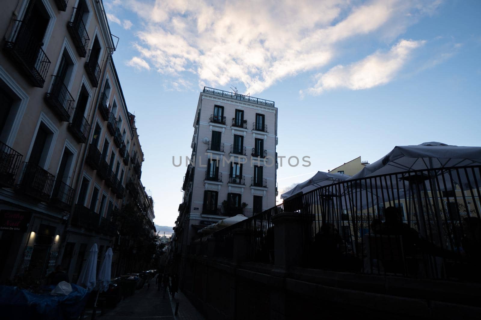 Old building in madrid with blue sky and white clouds by xavier_photo
