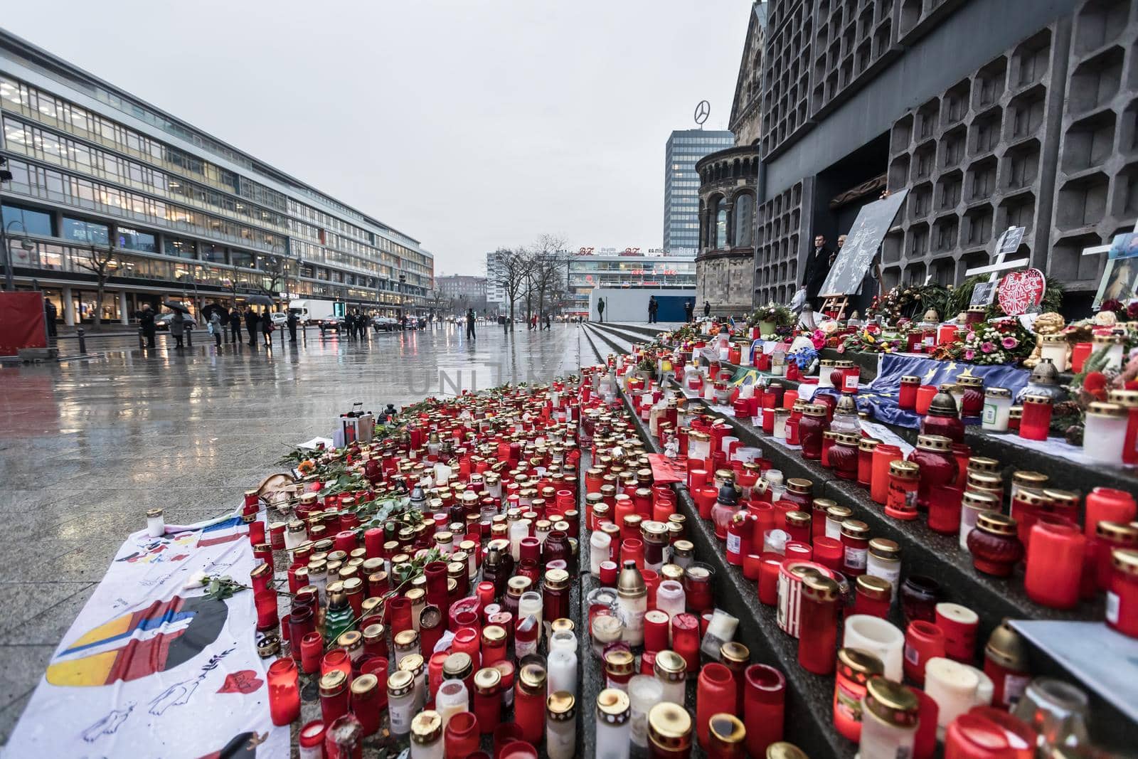 BERLIN, GERMANY - Jan 30, 2017: Candles and flowers in tribute to victims of December 19, 2016 terrorist attack in the center of western Berlin