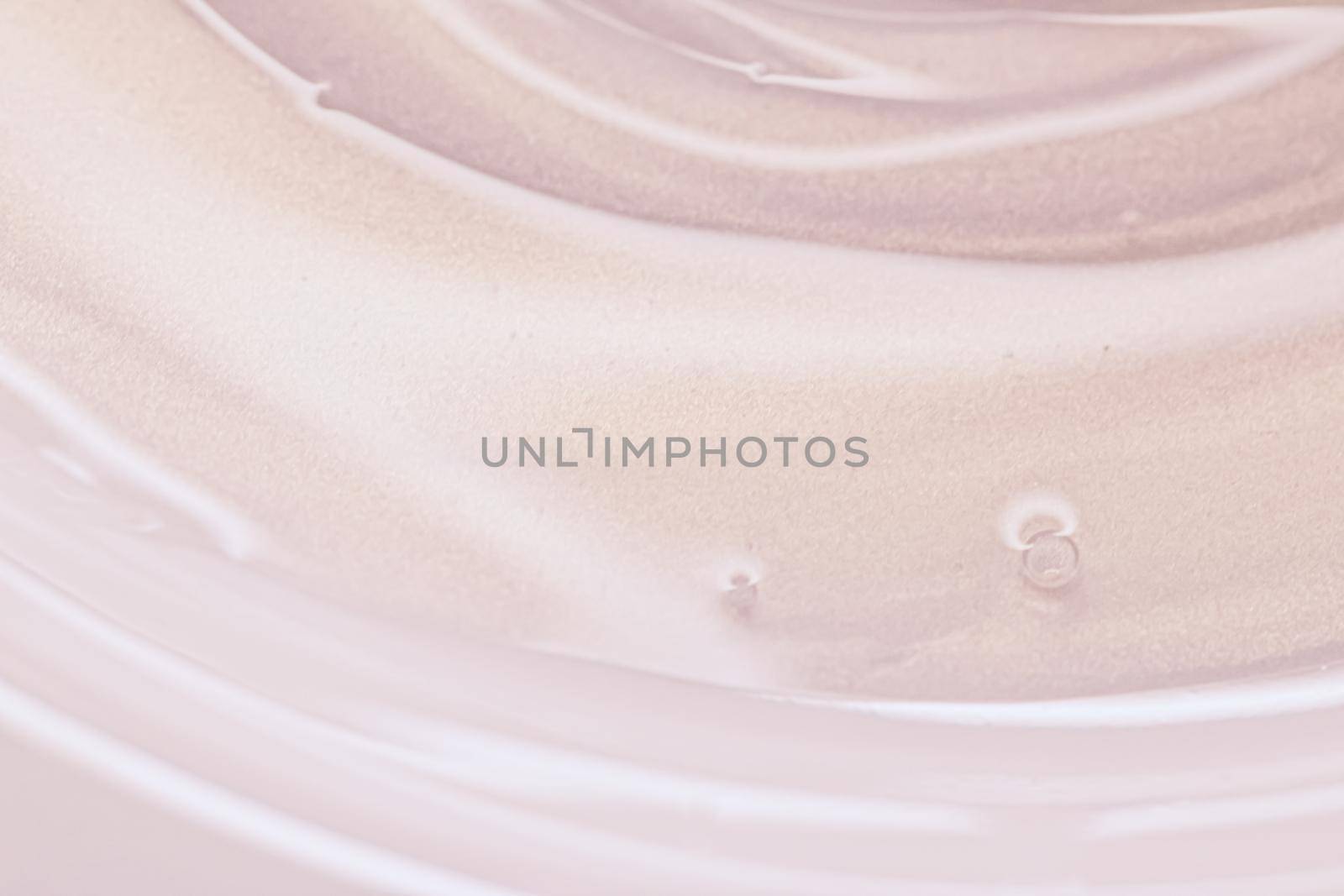 Glowing cosmetic emulsion, rose gold cream or lotion as beauty and skincare background closeup