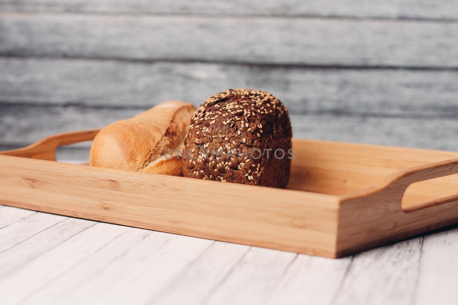 white dark bread whole grain homemade cakes wooden tray breakfast. High quality photo