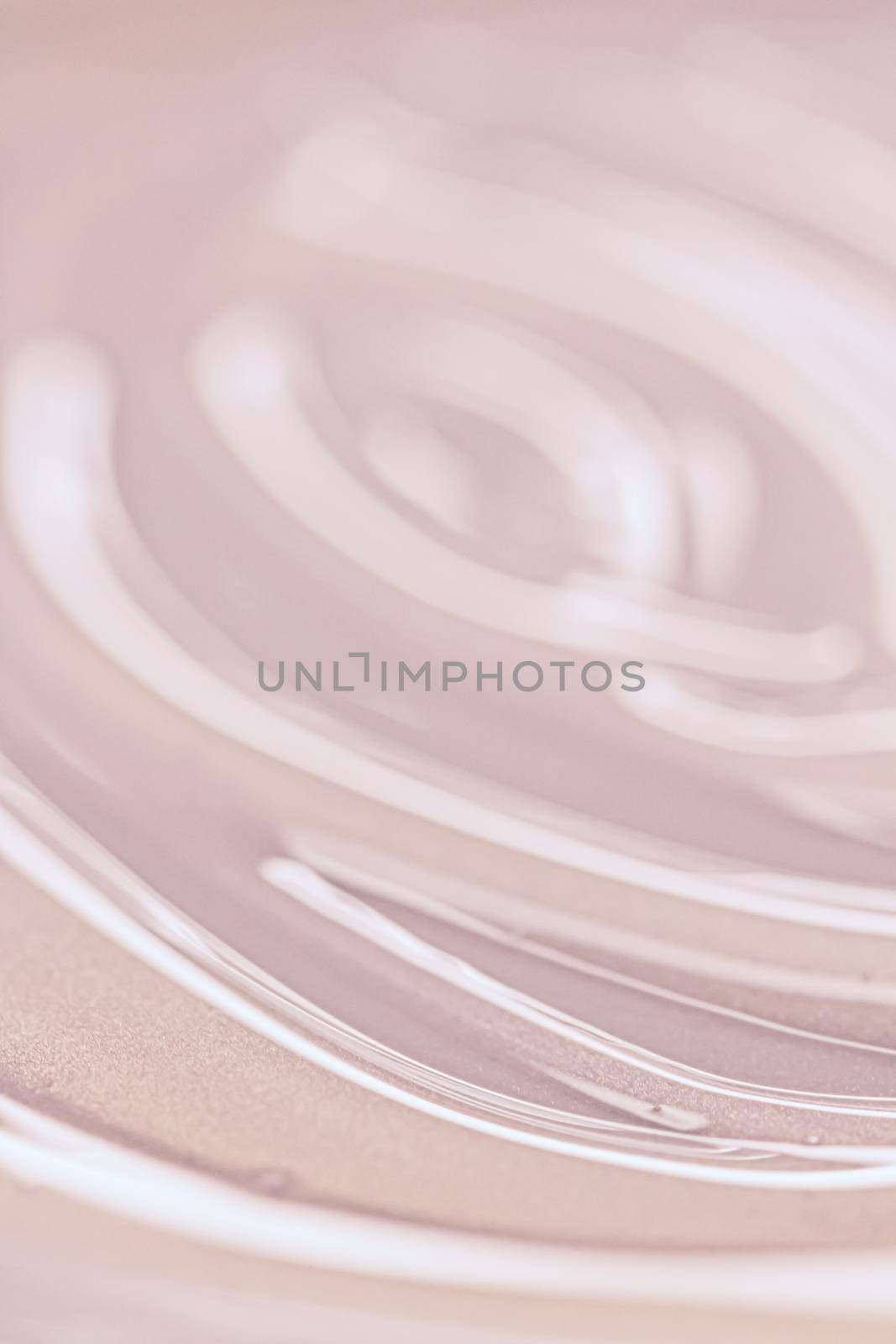 Glowing cosmetic emulsion, rose gold cream or lotion as beauty and skincare background closeup