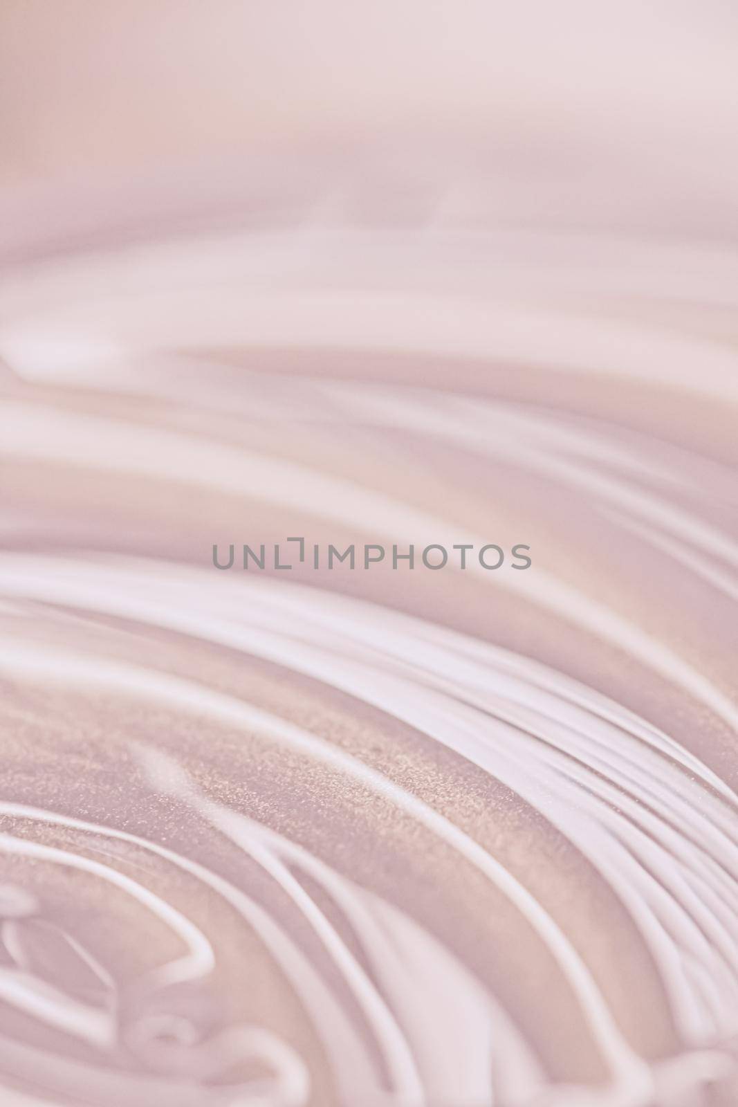 Glowing cosmetic emulsion, rose gold cream or lotion as beauty and skincare background closeup