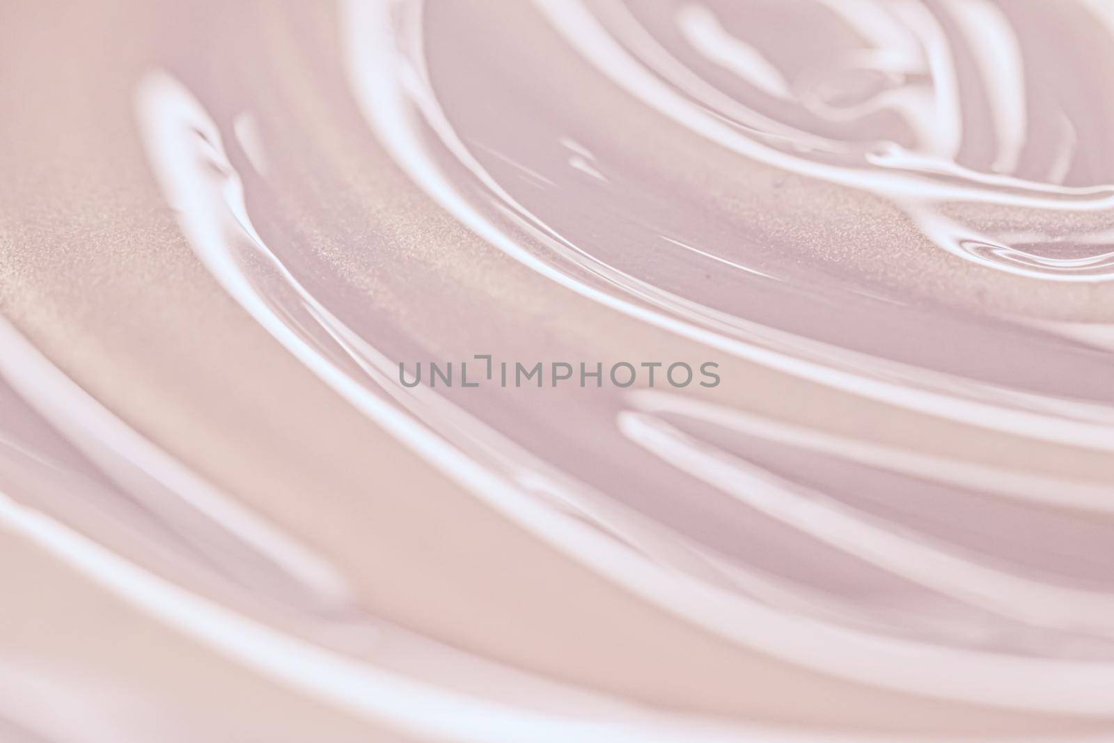 Glowing cosmetic emulsion, rose gold cream or lotion as beauty and skincare background closeup