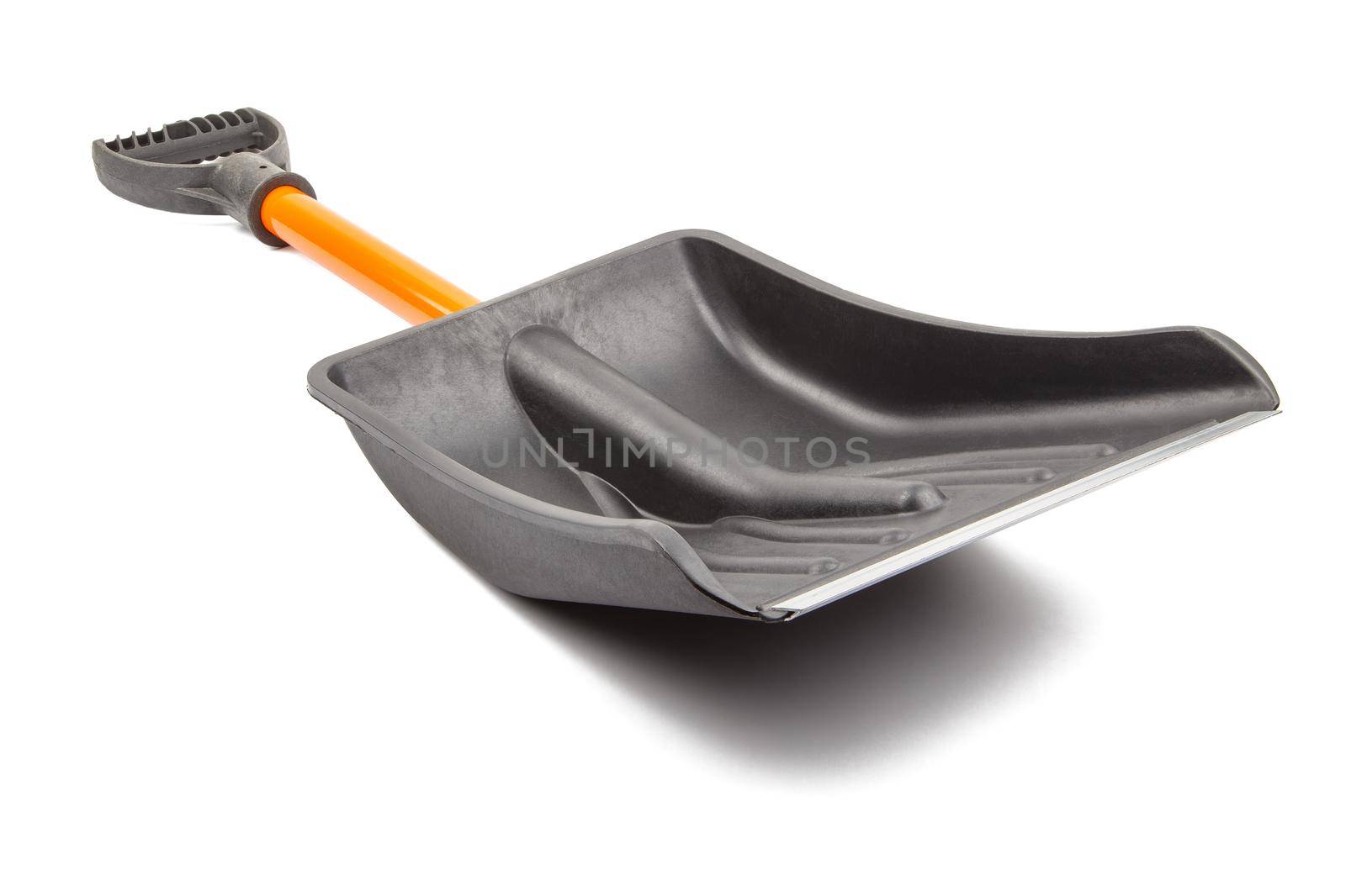 small plastic snow shovel, isolated on white background - back side, laid down, diagonal perspective blade toward camera