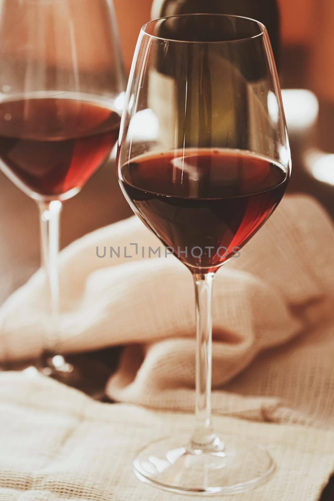 Traditional red house wine served in crystal glasses, closeup