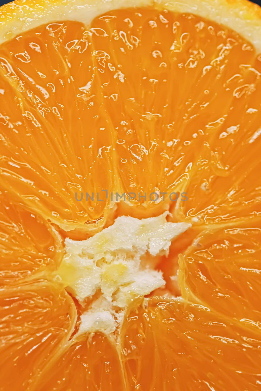 Juicy oranges half cut and sliced, healthy food and fruit closeup