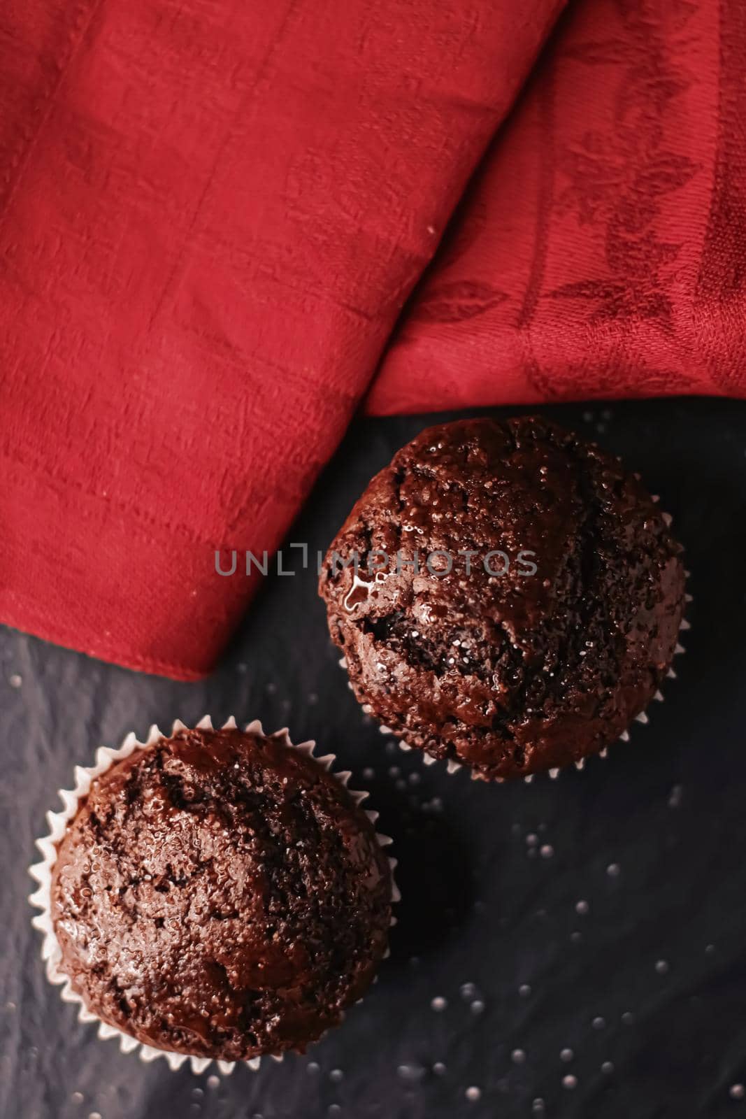 Two chocolate muffins freshly baked at home, homemade comfort food recipe by Anneleven