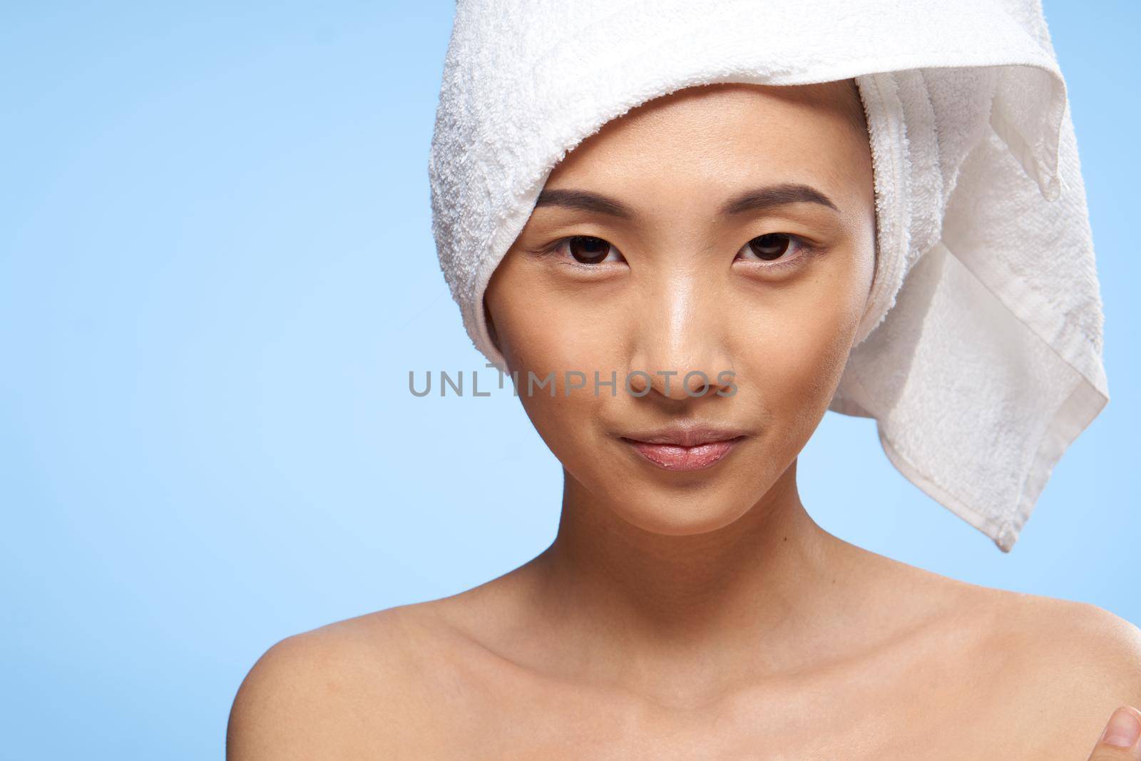asian woman bare shoulders clear skin health rejuvenation close-up. High quality photo