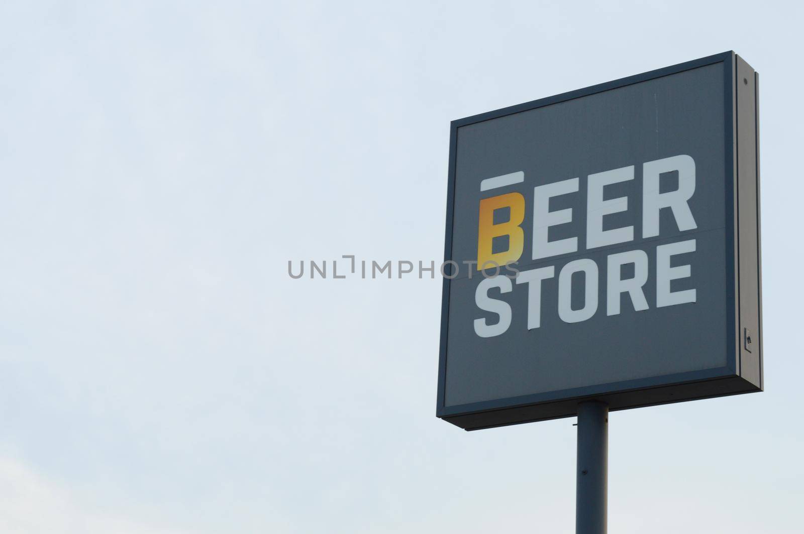 SMITHS FALLS, ONTARIO, CANADA, MARCH 10, 2021: Closeup view of The Beer Store sign located in the small town of Smiths Falls, ON, during the late winter season.