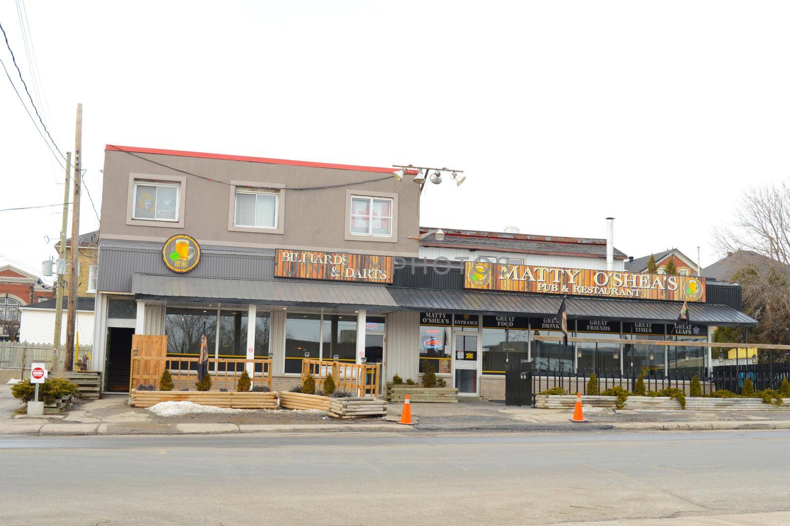 SMITHS FALLS, ONTARIO, CANADA, MARCH 10, 2021: A view of Matty O'Shea's Pub and Restaurant from across the street located in small town Smiths Falls during the late winter season.