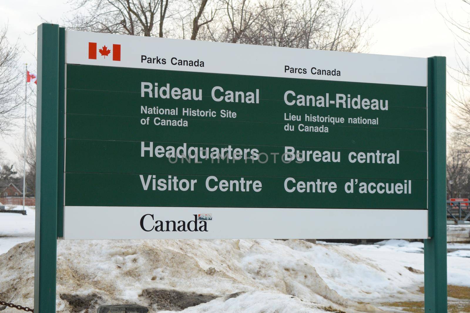 SMITHS FALLS, ONTARIO, CANADA, MARCH 10, 2021: Closeup view of the sign for the Parks Canada Rideau Canal National Historic Site Headquarters Visitor Centre located downtown Smiths Falls, ON, on a late winter afternoon.