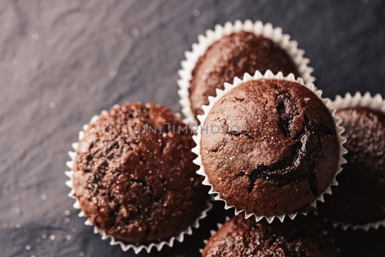 Homemade chocolate muffins, baked comfort food recipe concept