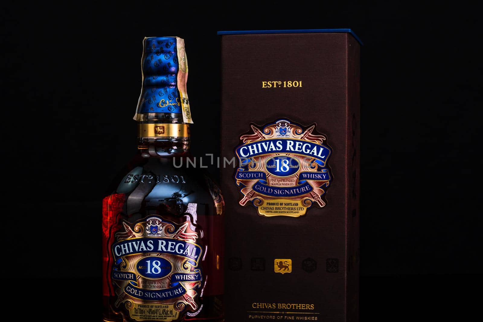 Chivas Regal 18 is blended from whiskies matured for at least 18 years. Whisky bottle on barrel. Illustrative editorial photo Bucharest, Romania, 2021