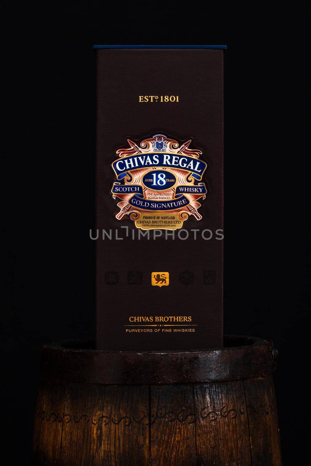 Chivas Regal 18 is blended from whiskies matured for at least 18 years. Whisky bottle on barrel. Illustrative editorial photo Bucharest, Romania, 2021 by vladispas