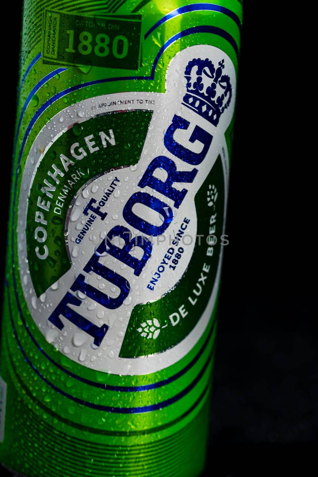 Condensation water droplets on Tuborg beer can isolated on black. Bucharest, Romania, 2020 by vladispas