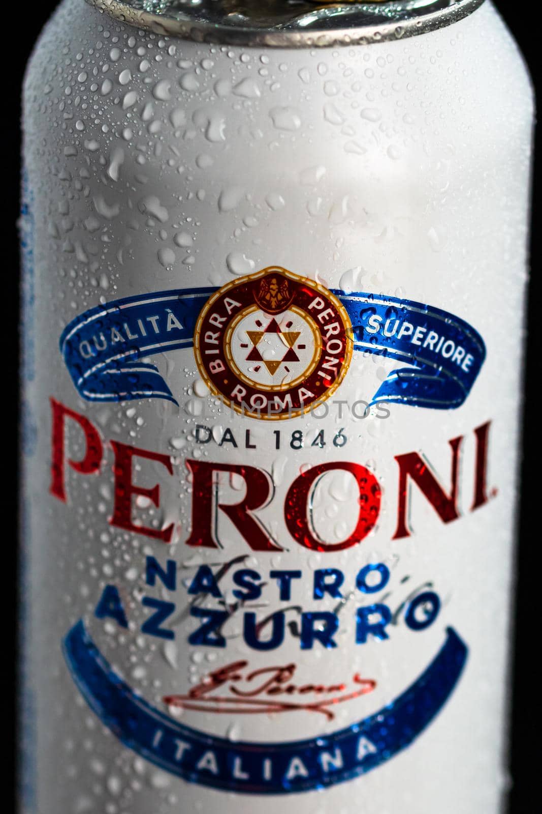 Detail of water droplets on Peroni Nastro Azzurro, a premium lager beer. Studio photo shoot in Bucharest, Romania, 2021 by vladispas