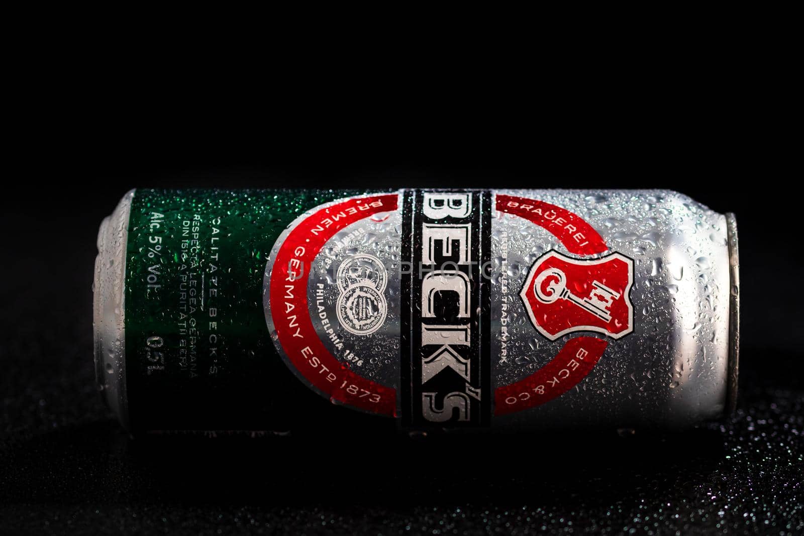 Condensation water droplets on Beck`s beer can isolated on black. Bucharest, Romania, 2020 by vladispas
