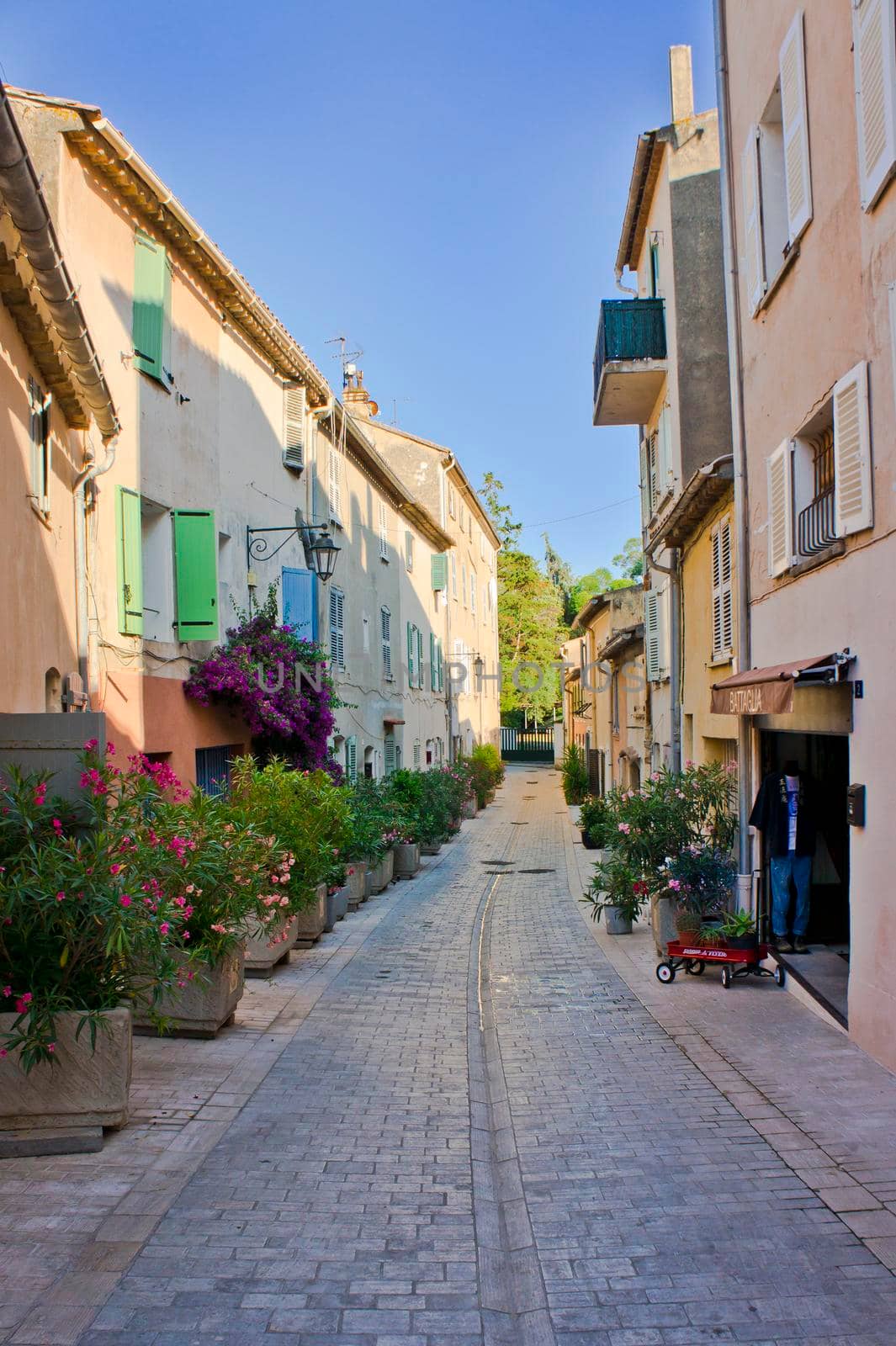 Saint Tropez, Old city street view with colorful houses, Côte d'Azur. France, Europe by giannakisphoto