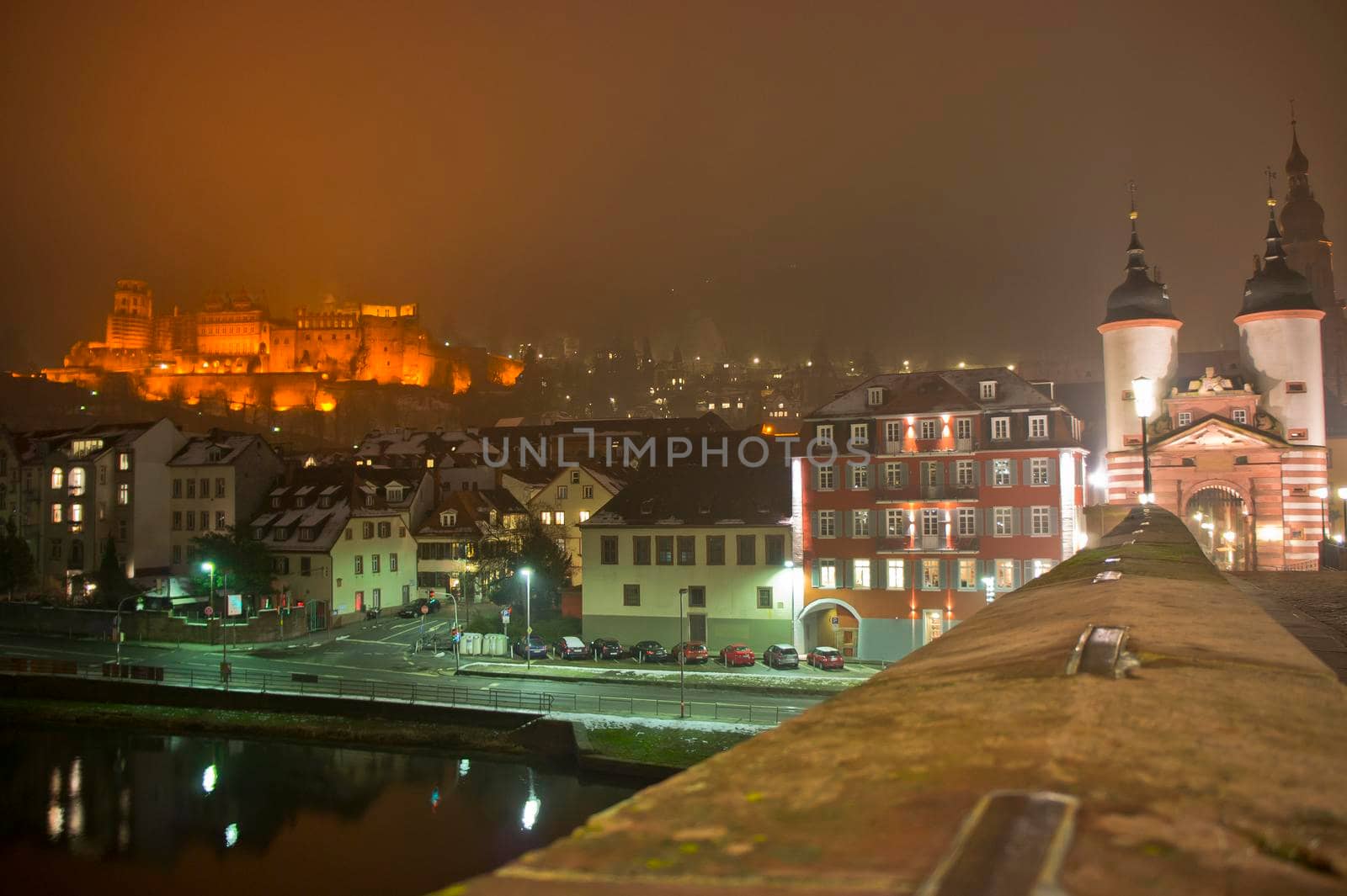 Heidelberg, Snowy night city view by the river Rhein, Karl Theodor Bridge, Germany, Europe