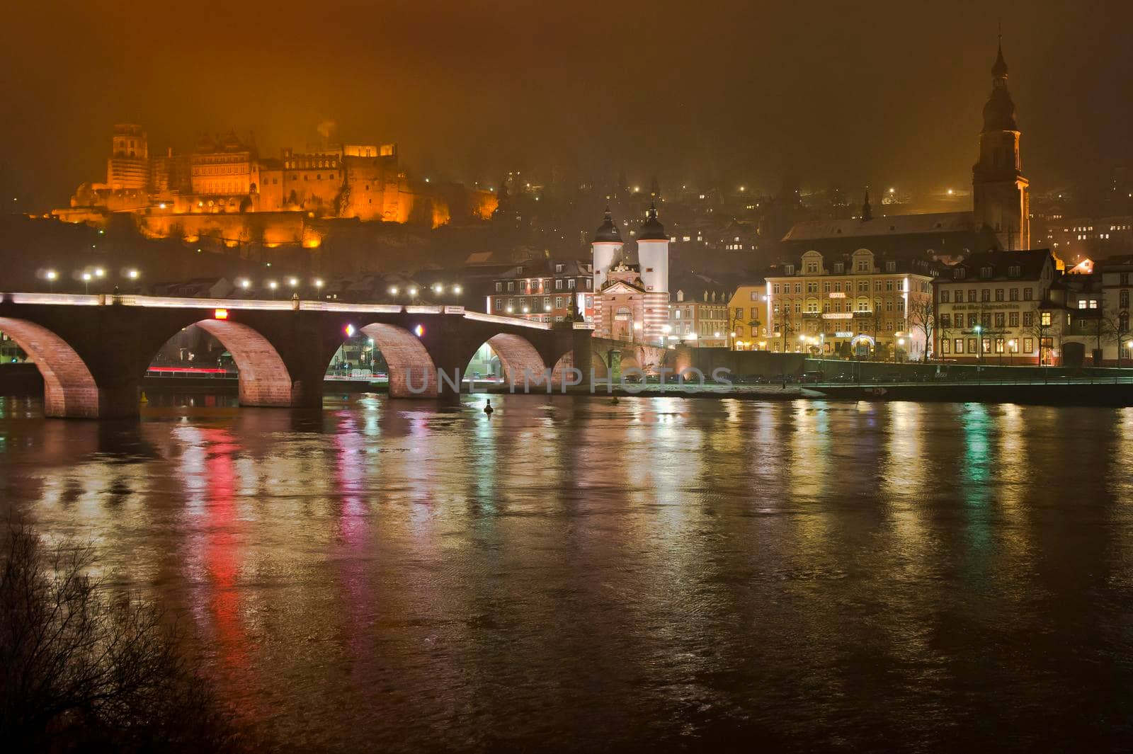 Heidelberg, Snowy night city view by the river Rhein, Karl Theodor Bridge, Germany, Europe