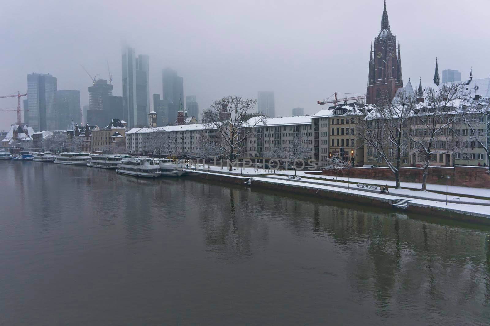 Frankfurt, Snowy day city view by the river Rhein, Germany, Europe