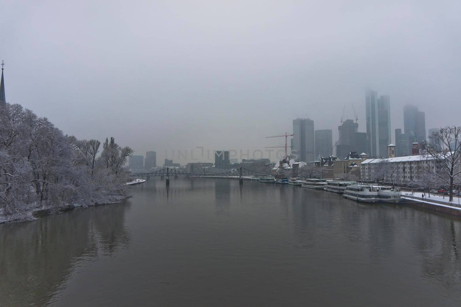 Frankfurt, Snowy day city view by the river Rhein, Germany, Europe