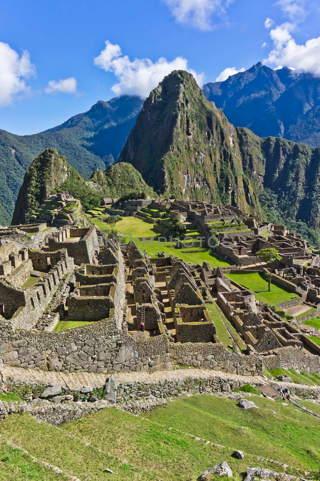 Machu Picchu on a sunny day, Peru, South America by giannakisphoto