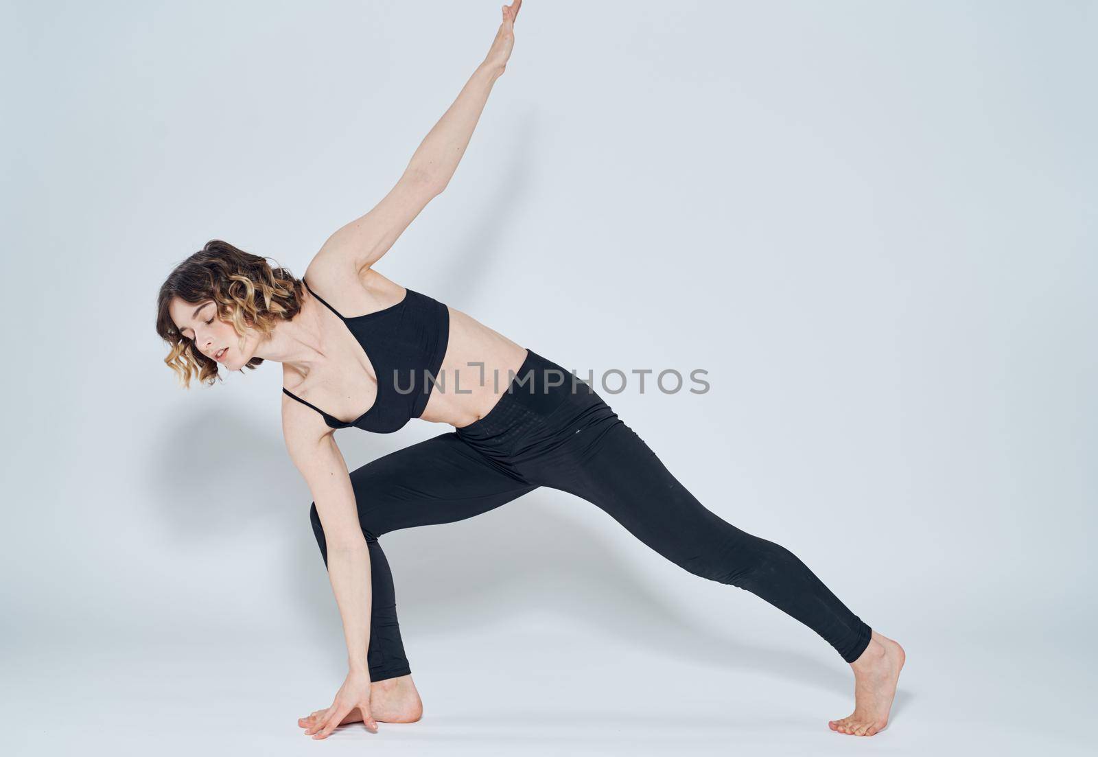 Yoga lunges forward right leg woman sport gymnastics. High quality photo