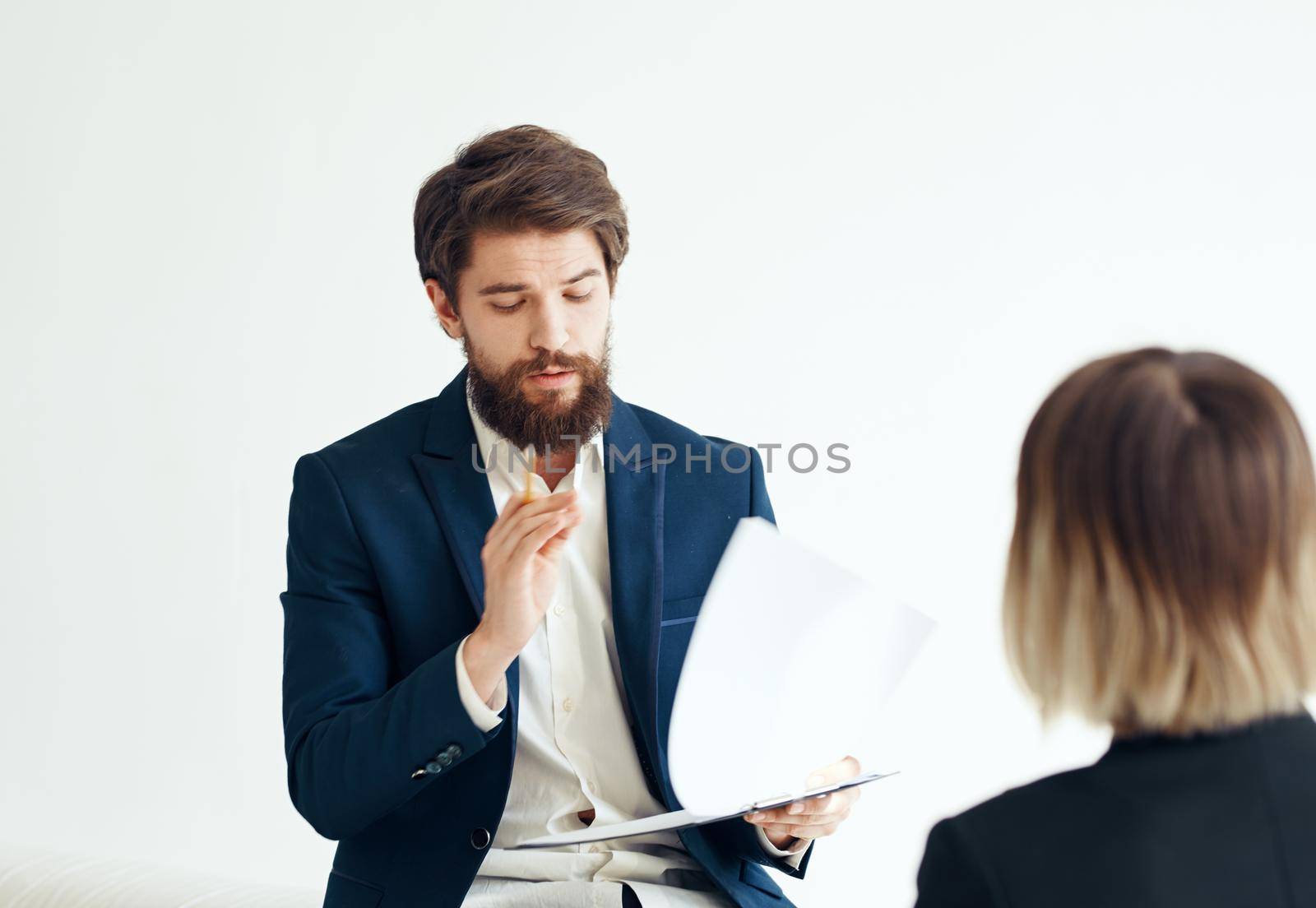 A man with documents in a suit and a woman for a job interview. High quality photo