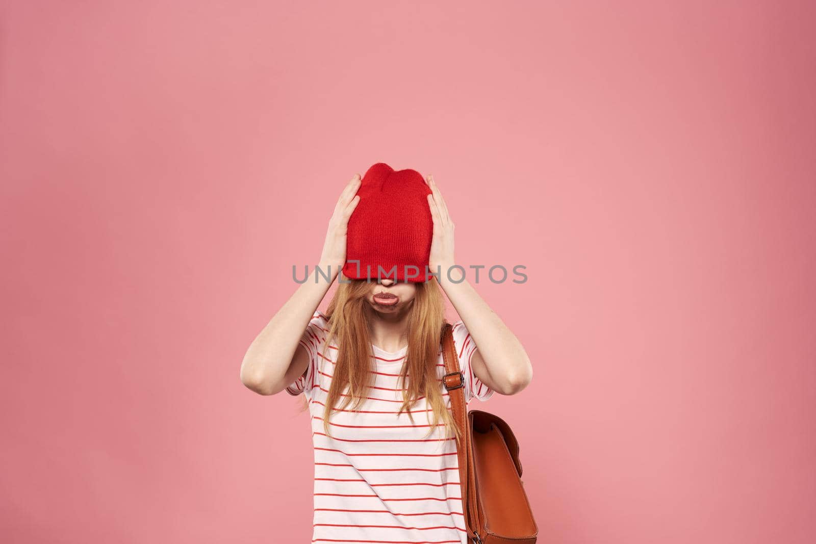 Cheerful woman studio lifestyle pink background fun model. High quality photo