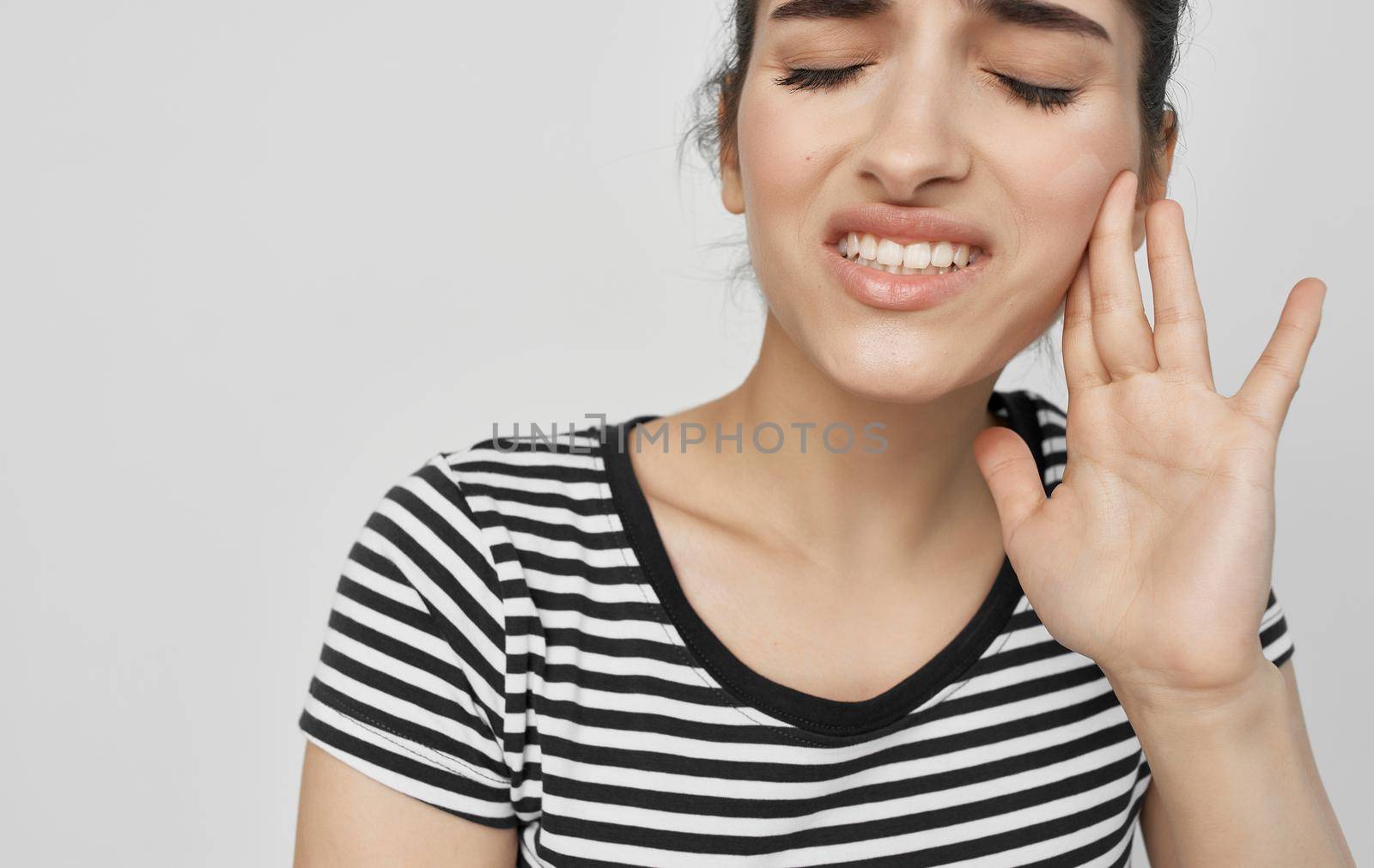 woman holding face dental problems pain dissatisfaction. High quality photo