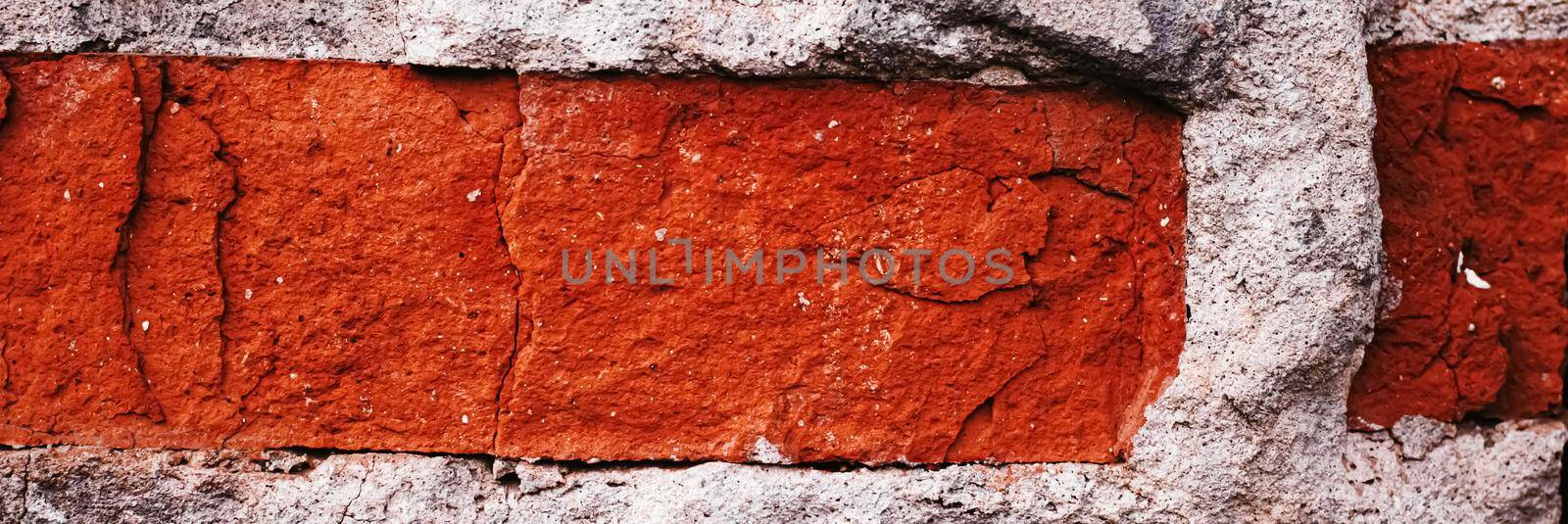 Old brick wall texture as grunge background and urban detail closeup