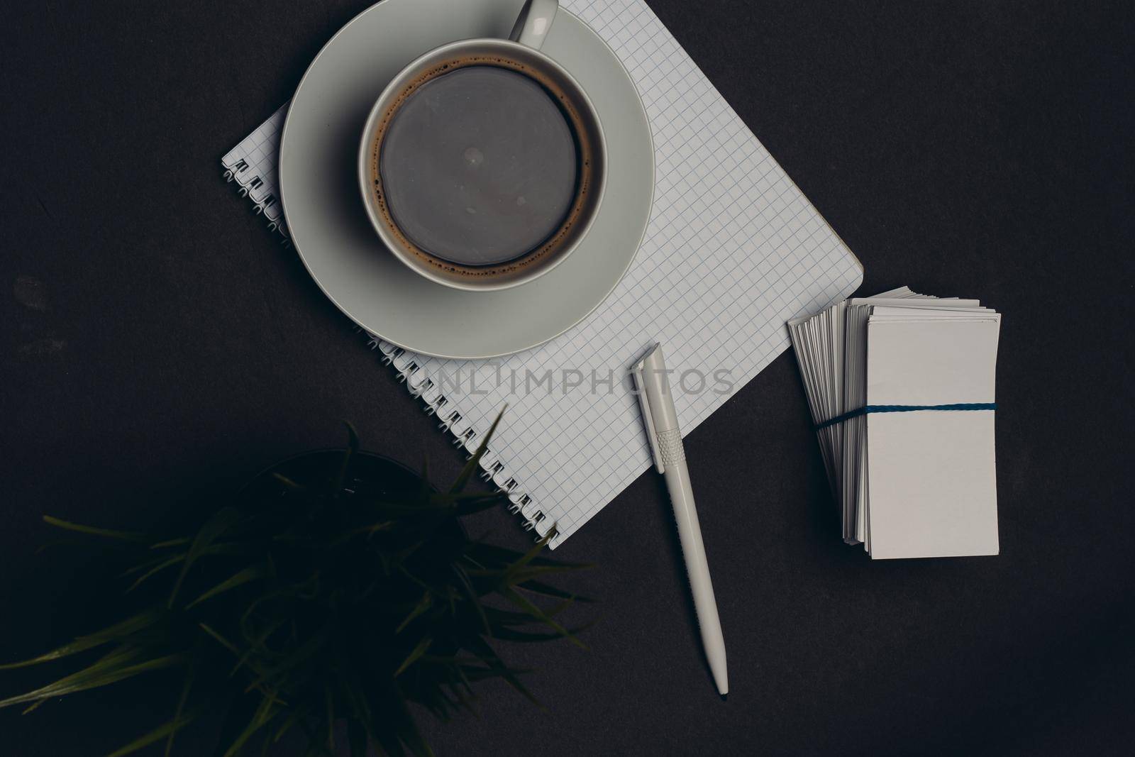 coffee cup desktop business card pen office close-up. High quality photo