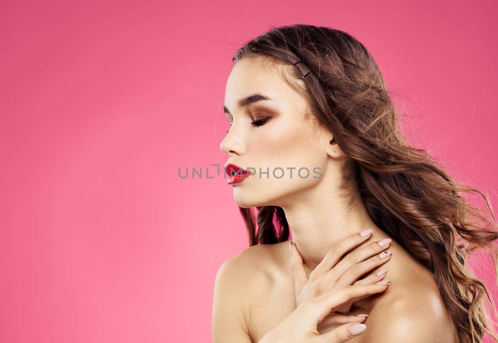 Woman model brunette on pink background bare shoulders cropped view by SHOTPRIME