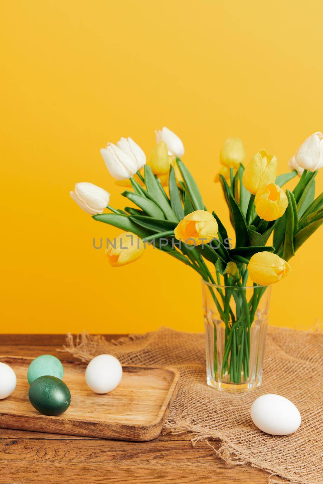 colorful eggs tulip bouquet spring holiday easter. High quality photo