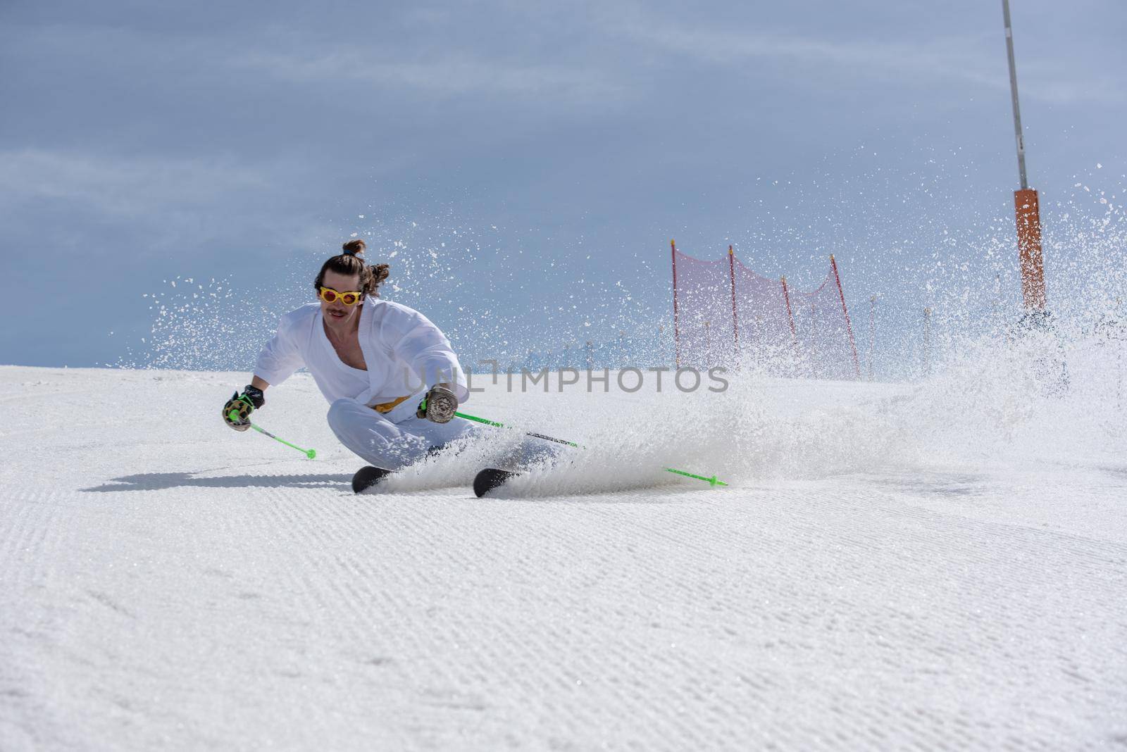 Skier dressed as a karateka at a ski station.