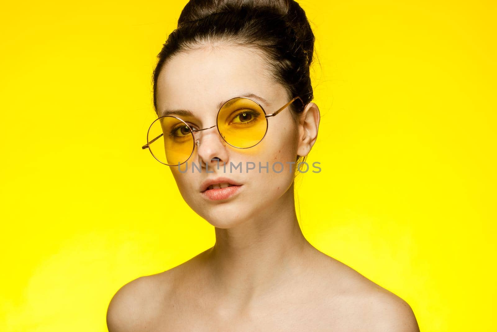 brunette with bare shoulders attractive glamor look yellow background by SHOTPRIME