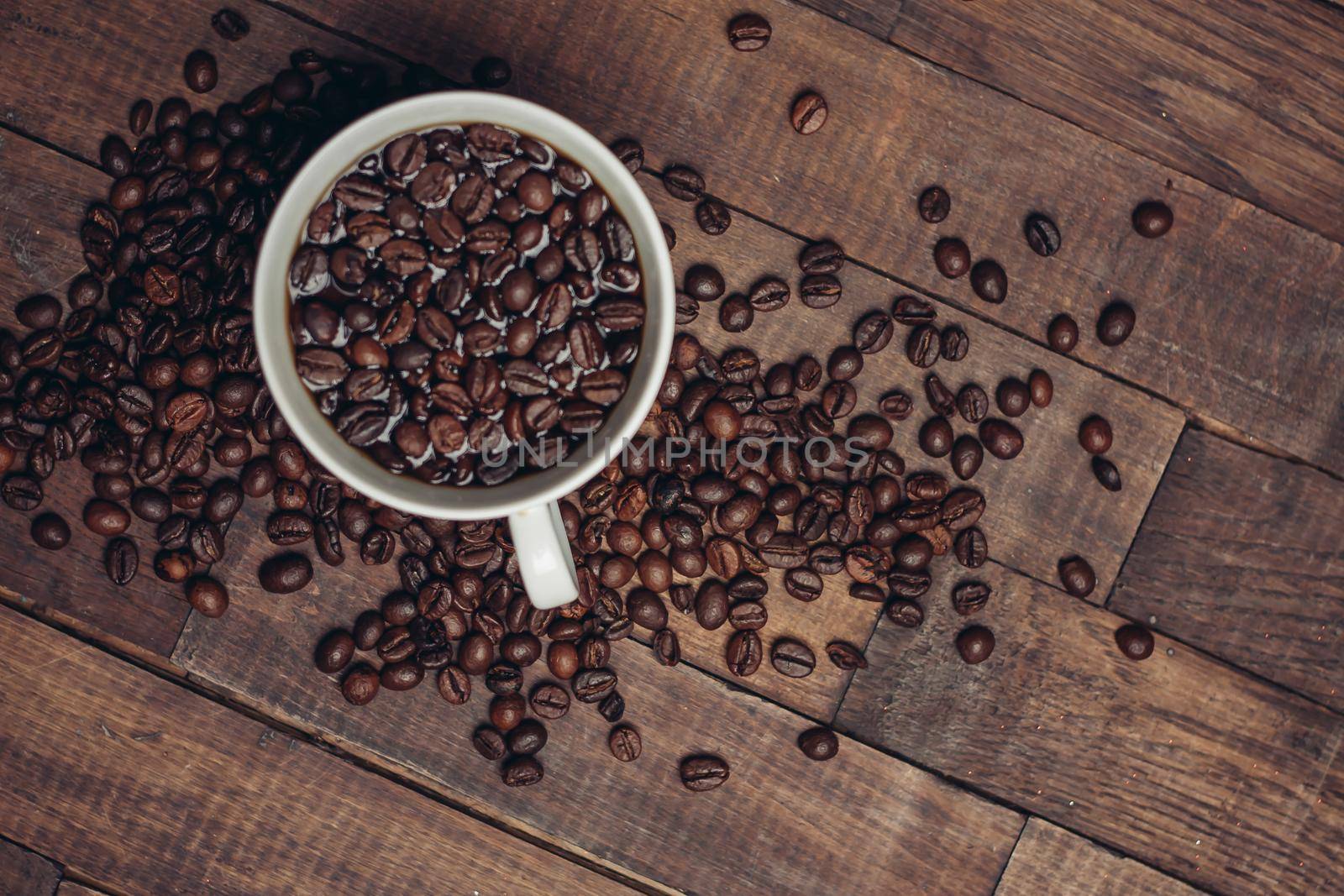 white cup with coffee beans aromatic drink morning. High quality photo